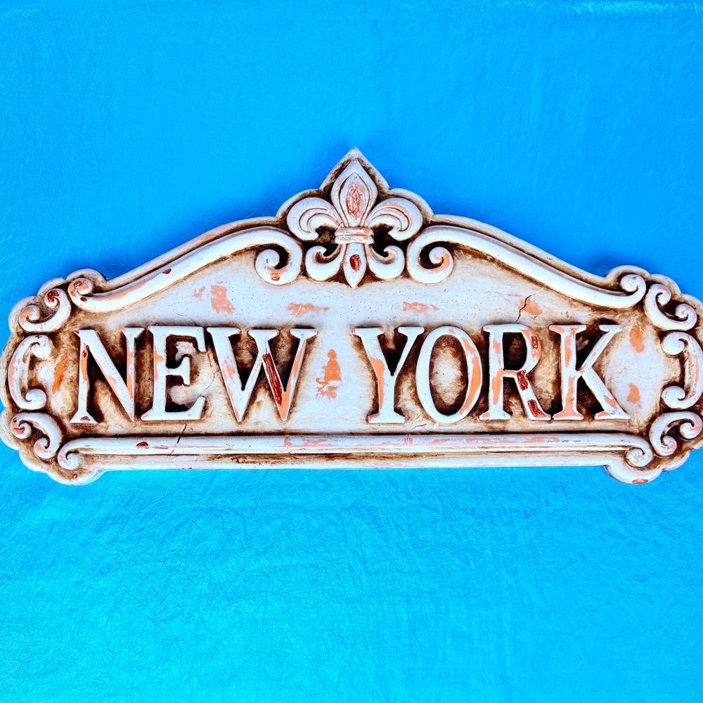 New York wall plaque in natural sculpted tones 8 x 18 x1”